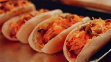 Process of preparing Irresistible chili cheese Hot Dogs. Taste USA cuisine.