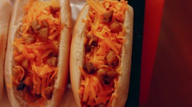 Process of preparing Irresistible chili cheese Hot Dogs. Taste USA cuisine.