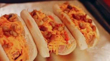 Process of preparing Irresistible chili cheese Hot Dogs. Taste USA cuisine.