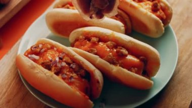 Process of preparing Irresistible chili cheese Hot Dogs. Taste USA cuisine.