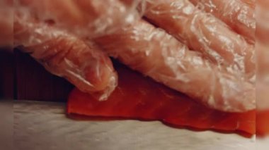 Preparing process of Cinematographic Smoked Salmon bagels. USA cusine.