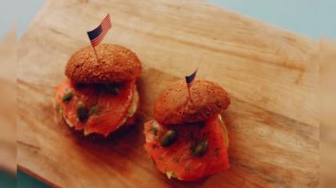 Preparing process of Cinematographic Smoked Salmon bagels. USA cusine.