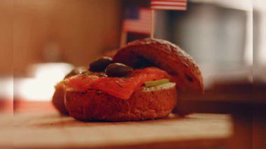 Preparing process of Cinematographic Smoked Salmon bagels. USA cusine.