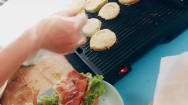 transition effect of green tomato blt burger, vegan burger.