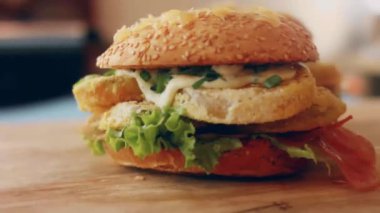 transition effect of green tomato blt burger, vegan burger.