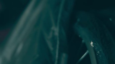 A disabled man assembles a stroller. Assembling strollers for people with disabilities in a poor country.