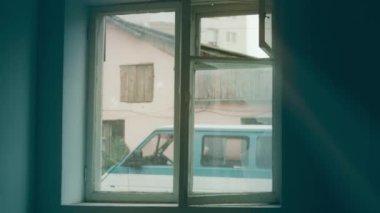 A disabled man assembles a stroller. Assembling strollers for people with disabilities in a poor country.
