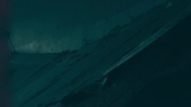 Destruction: ruin of abandoned and demolished building after a war, grenade explosion or cataclysm. Bare walls of derelict old house due to hurricane, earthquake or tsunami damage.