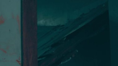 Destruction: ruin of abandoned and demolished building after a war, grenade explosion or cataclysm. Bare walls of derelict old house due to hurricane, earthquake or tsunami damage.