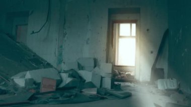 Destruction: ruin of abandoned and demolished building after a war, grenade explosion or cataclysm. Bare walls of derelict old house due to hurricane, earthquake or tsunami damage.