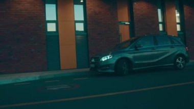 Silhouette of beautiful car on smoked dark background . Car lights on fog