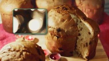 Noel için geleneksel İtalyan hamur işleri ve kurutulmuş meyveler. Milan 'ın tatlı ekmeği Panettone. Kesildikten sonra tahta tahtanın üzerine bir parça panettone bırakılmış. Yüksek kalite 4k görüntü.