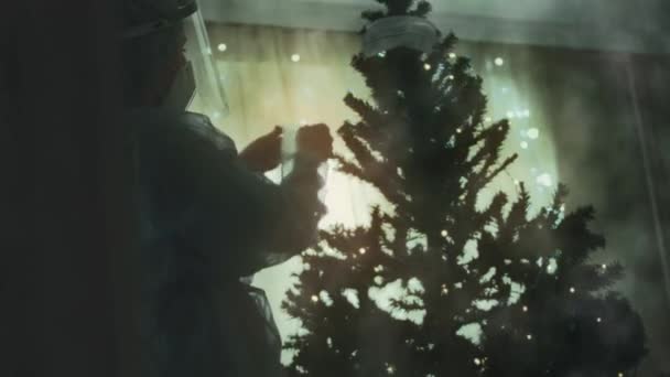 Close Sad Doctor Protective Suit Visor Decorates Christmas Tree Medical — Stock Video