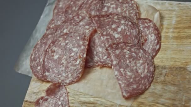 Fresh Italian Sliced Salami Sausage Wooden Cutting Board Cutting Heart — Stock Video