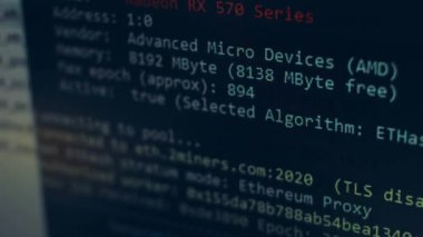 Cryptocurrency mining on a computer screen. The algorithm of the computer program on the monitor. Execution of the program code for the mining program. Pop-up lines of a computer program.