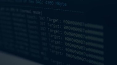 Cryptocurrency mining on a computer screen. The algorithm of the computer program on the monitor. Execution of the program code for the mining program. Pop-up lines of a computer program.