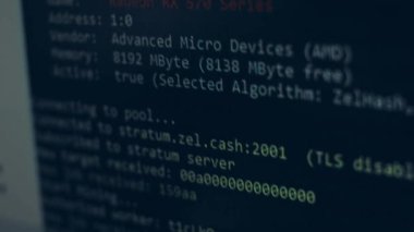Cryptocurrency mining on a computer screen. The algorithm of the computer program on the monitor. Execution of the program code for the mining program. Pop-up lines of a computer program.