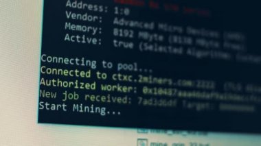 Cryptocurrency mining on a computer screen. The algorithm of the computer program on the monitor. Execution of the program code for the mining program. Pop-up lines of a computer program.
