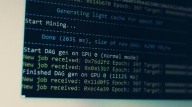Cryptocurrency mining on a computer screen. The algorithm of the computer program on the monitor. Execution of the program code for the mining program. Pop-up lines of a computer program.