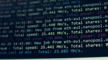 Cryptocurrency mining on a computer screen. The algorithm of the computer program on the monitor. Execution of the program code for the mining program. Pop-up lines of a computer program.