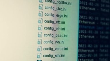 Cryptocurrency mining on a computer screen. The algorithm of the computer program on the monitor. Execution of the program code for the mining program. Pop-up lines of a computer program.