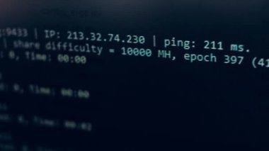 Cryptocurrency mining on a computer screen. The algorithm of the computer program on the monitor. Execution of the program code for the mining program. Pop-up lines of a computer program.