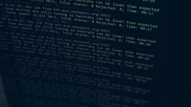Cryptocurrency mining on a computer screen. The algorithm of the computer program on the monitor. Execution of the program code for the mining program. Pop-up lines of a computer program.
