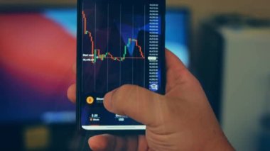 Caucasian male making a payment with bitcoins cryptocurrency using his smartphone. Custom application interface design. 4K UHD RAW edited footage