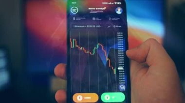 Caucasian male making a payment with bitcoins cryptocurrency using his smartphone. Custom application interface design. 4K UHD RAW edited footage