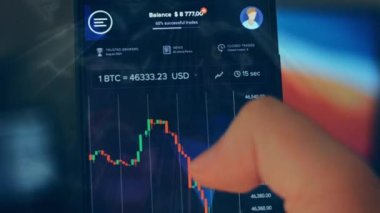Caucasian male making a payment with bitcoins cryptocurrency using his smartphone. Custom application interface design. 4K UHD RAW edited footage