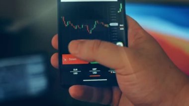 Caucasian male making a payment with bitcoins cryptocurrency using his smartphone. Custom application interface design. 4K UHD RAW edited footage