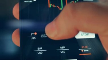 Caucasian male making a payment with bitcoins cryptocurrency using his smartphone. Custom application interface design. 4K UHD RAW edited footage