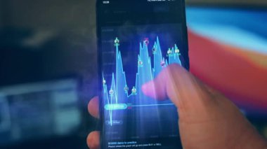 Caucasian male making a payment with bitcoins cryptocurrency using his smartphone. Custom application interface design. 4K UHD RAW edited footage