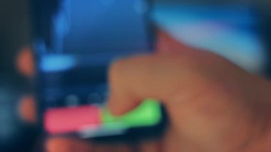 Caucasian male making a payment with bitcoins cryptocurrency using his smartphone. Custom application interface design. 4K UHD RAW edited footage