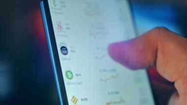 Caucasian male making a payment with bitcoins cryptocurrency using his smartphone. Custom application interface design. 4K UHD RAW edited footage