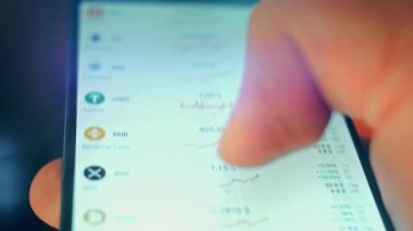 Caucasian male making a payment with bitcoins cryptocurrency using his smartphone. Custom application interface design. 4K UHD RAW edited footage