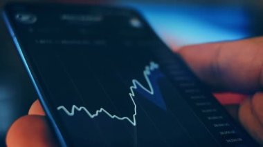 Caucasian male making a payment with bitcoins cryptocurrency using his smartphone. Custom application interface design. 4K UHD RAW edited footage