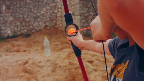 Childrens Hands Hold Bow Arrow Shoot Target Door — 비디오
