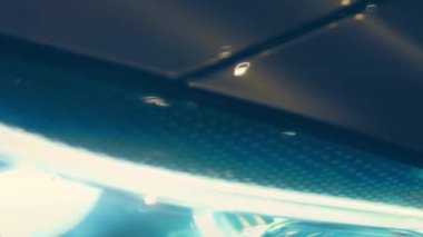 Silhouette of beautiful car on smoked dark background . Car lights on fog