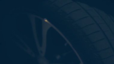 Silhouette of beautiful car on smoked dark background . Car lights on fog