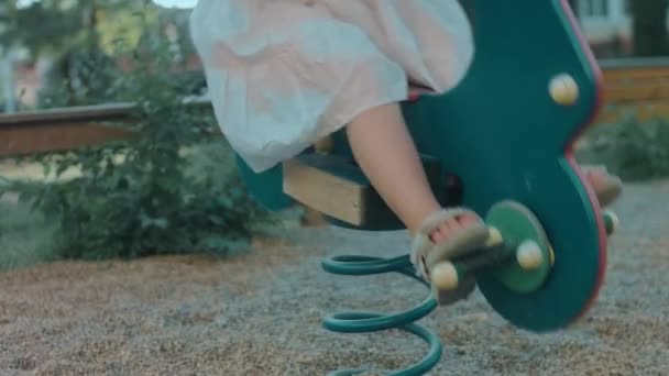 Little Preschool Girl Having Fun Playground Rocking Horse Concept Kindergarten — Stock Video