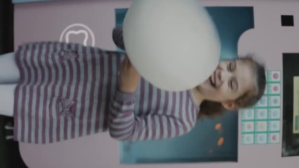 Vertical Shooting Happy School Girl Enjoying Cotton Candy Very Excited — Stock Video