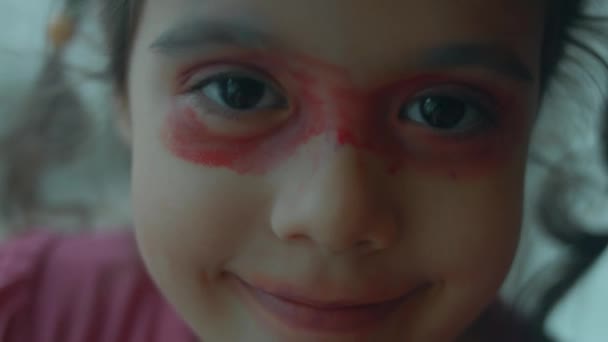 Cheerful Confident Little Caucasian Girl Painted Her Face Lipstick Eyeshadows — Stock Video