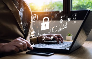 cyber security concept and internet privacy data protection. Businessmen protecting personal data on laptops and virtual interfaces. Username and password, encryption, disruption, modification