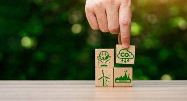 CO2 emission reduction concept, businessman with environmental technology Icons, global warming, sustainable development, renewable energy business. climate change, carbon capture, storage, reuse