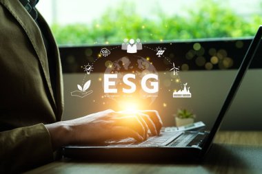 ESG environment social governance investment concept. Businessman using computer to analyze investment ESG. strategy that considers the environmental, company carbon labor practices, sustainability
