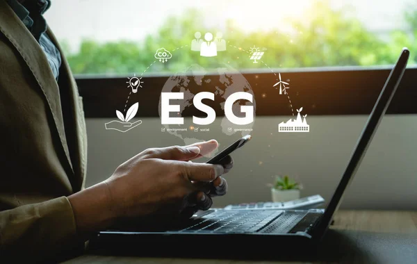 ESG environment social governance investment concept. Businessman using computer to analyze investment ESG. strategy that considers the environmental, company carbon labor practices, sustainability
