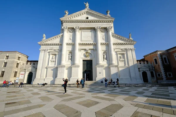 stock image Venice, Italy: Tourist taking selfies near the facade of the Church of San Giorgio Maggiore and Bell Tower. 