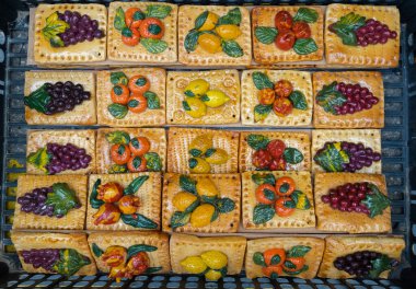 Traditional Easter decoration from reed and bread dough is installed on city streets each year in San Biagio Platani, Italy