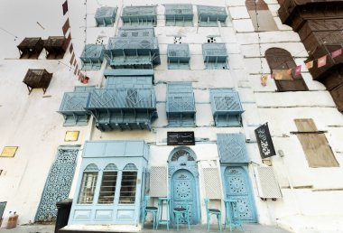 Al-Balad old town with traditional muslim houses with blue windows and balconies clipart